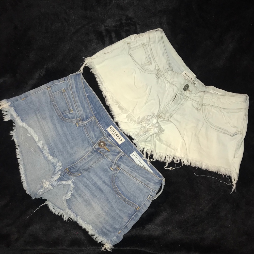 2 pairs of light wash frayed short shorts. size 5